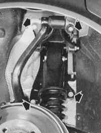 Задня підвіска коліс у повнопривідних моделей   Стрілки, що показують чотири кріпильні болти амортизаційної стійки (також у повнопривідних моделей)